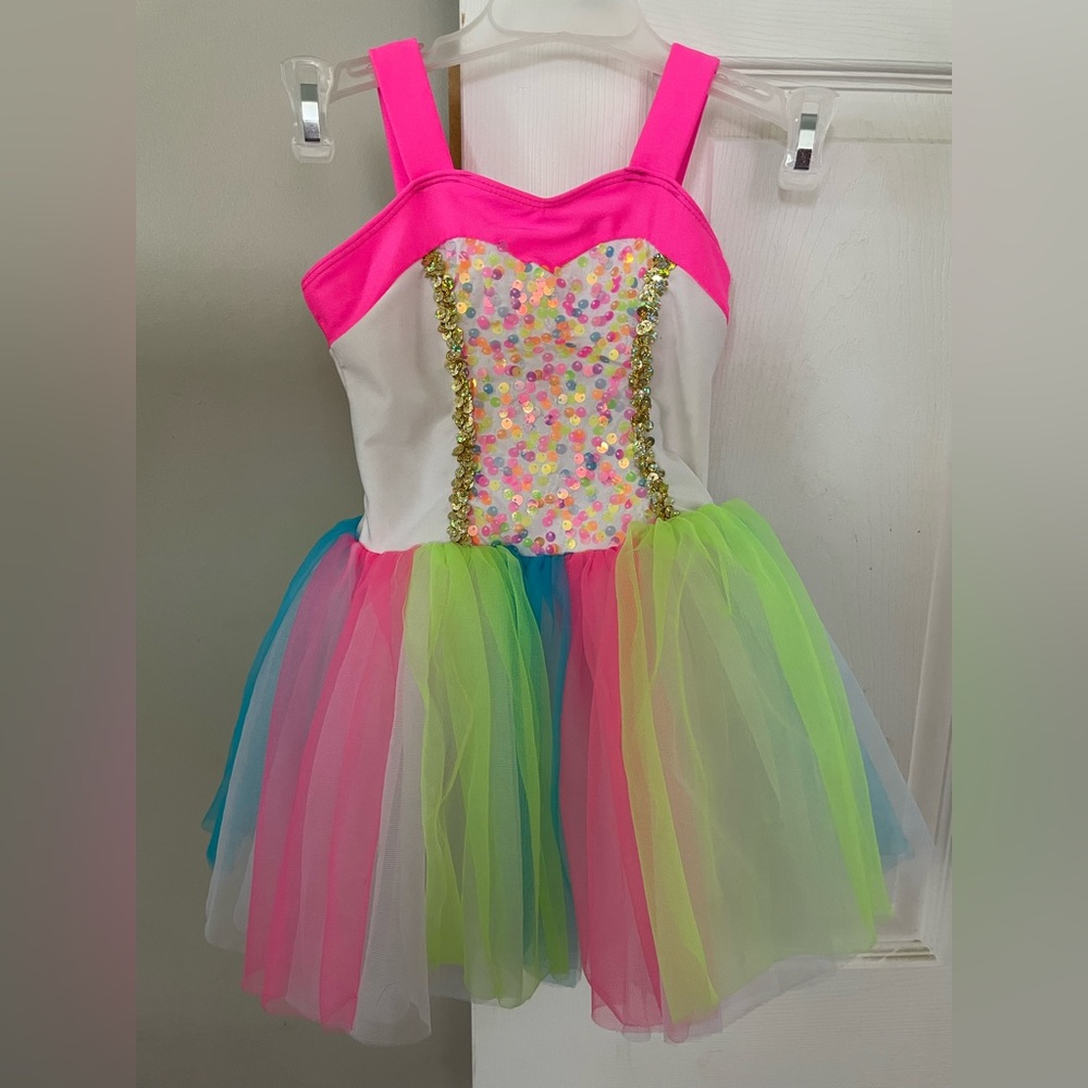 Like new Revolution girls size SC dance costume with tulle skirt and sequins.